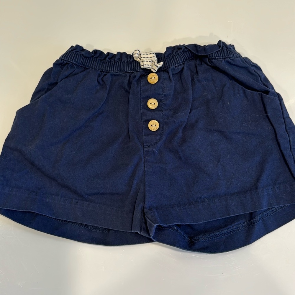 Zara Baby shorts in blue .drawstring and wooden buttons in front of. 12-18 mos.